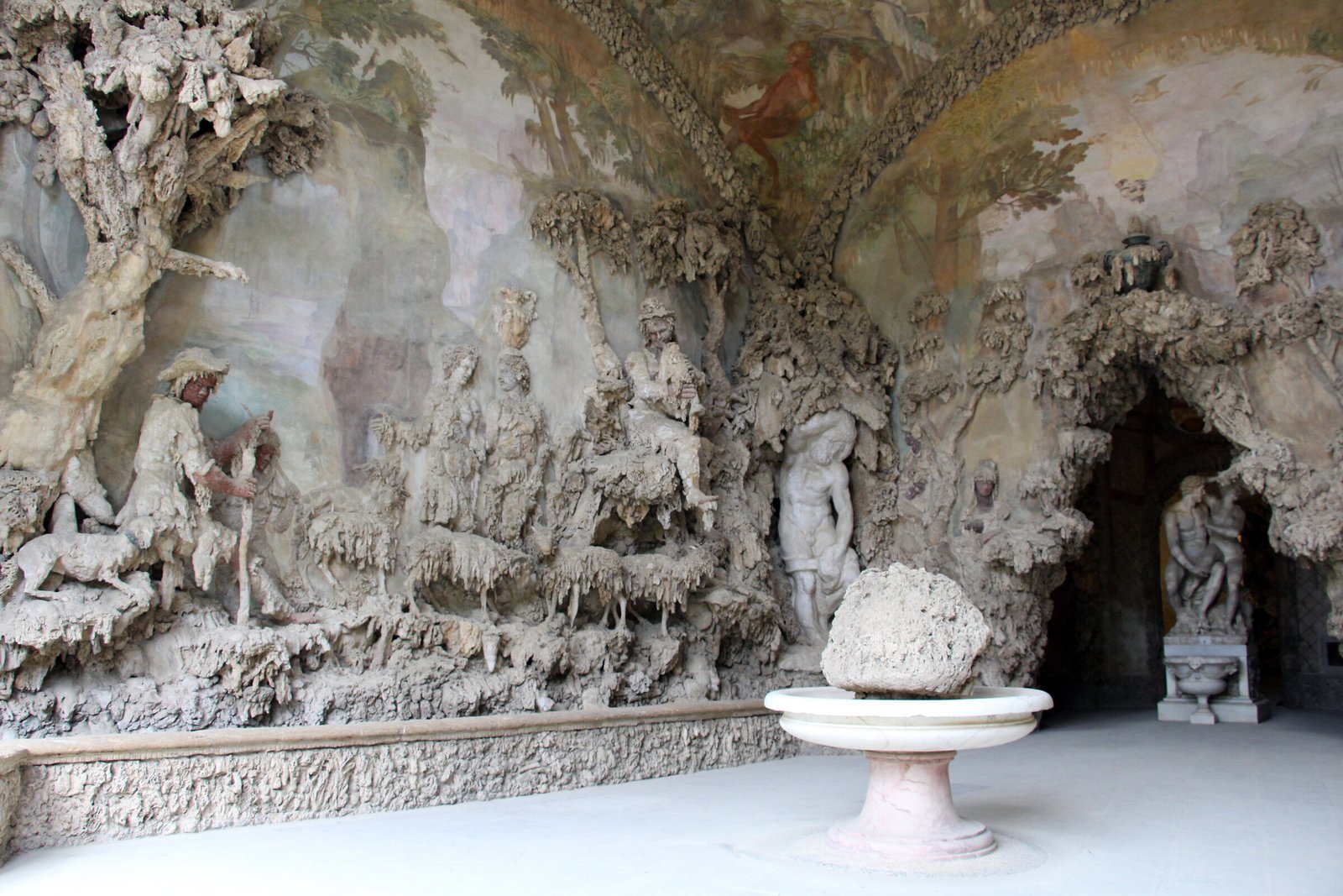 Façade of the Grotta del Buontalenti in the Boboli Gardens, with mannerist stalactite-like decoration and antique statues set in niches