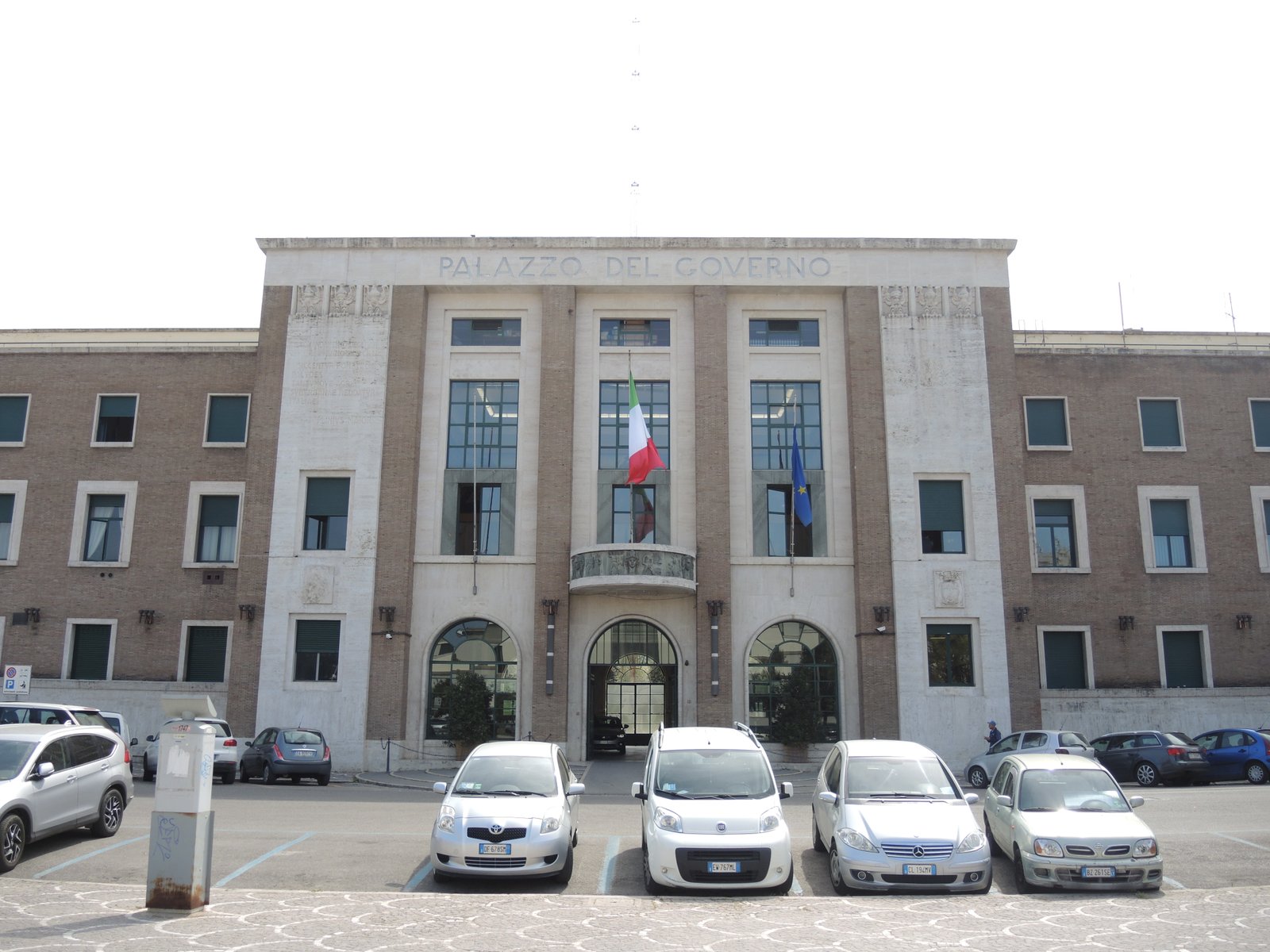 Frontal view of the Palazzo del Governo in Latina, monumental rationalist facade with central tower on Piazza della Liberta