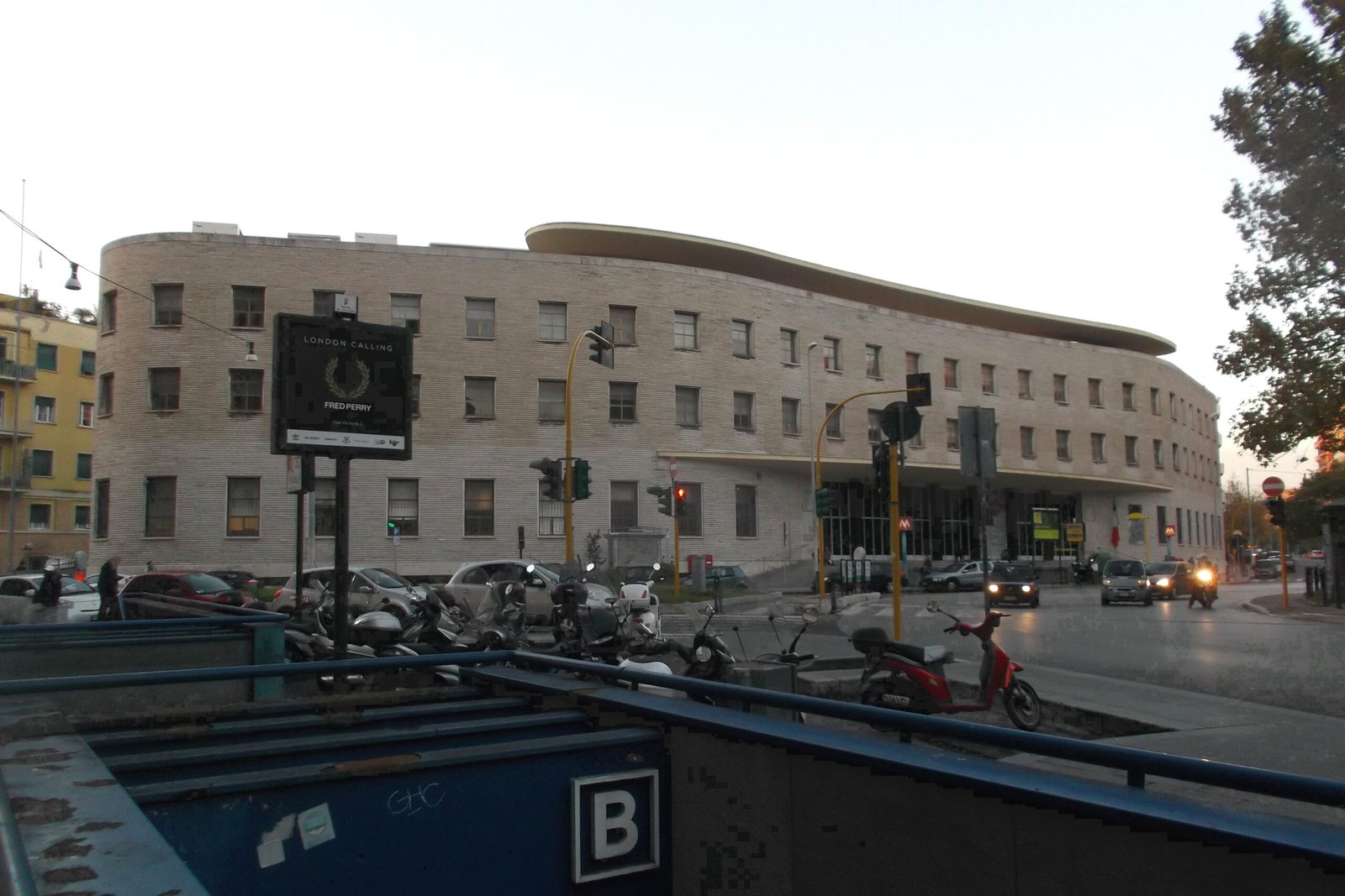 Curved travertine facade of the Roma Nomentano post office on Piazza Bologna by Mario Ridolfi