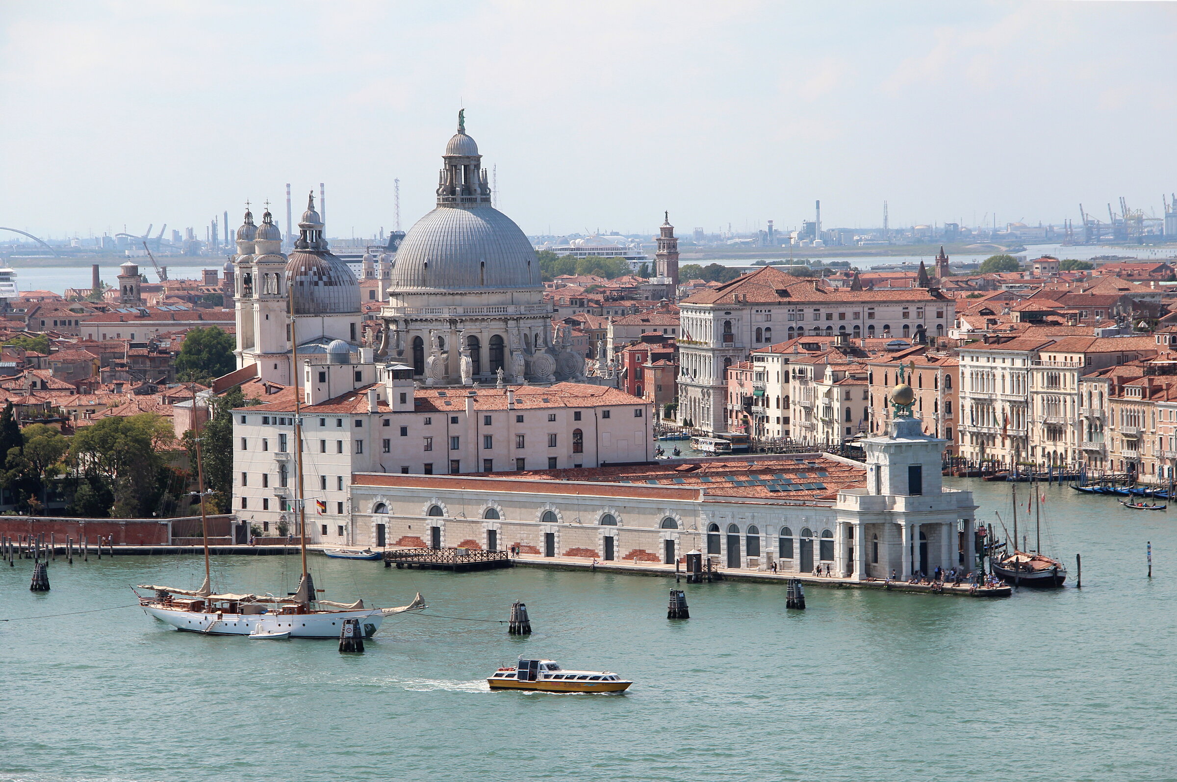 Punta della Dogana seen from the water, with the basilica of Santa Maria della Salute behind and the entrance of the Grand Canal on the right