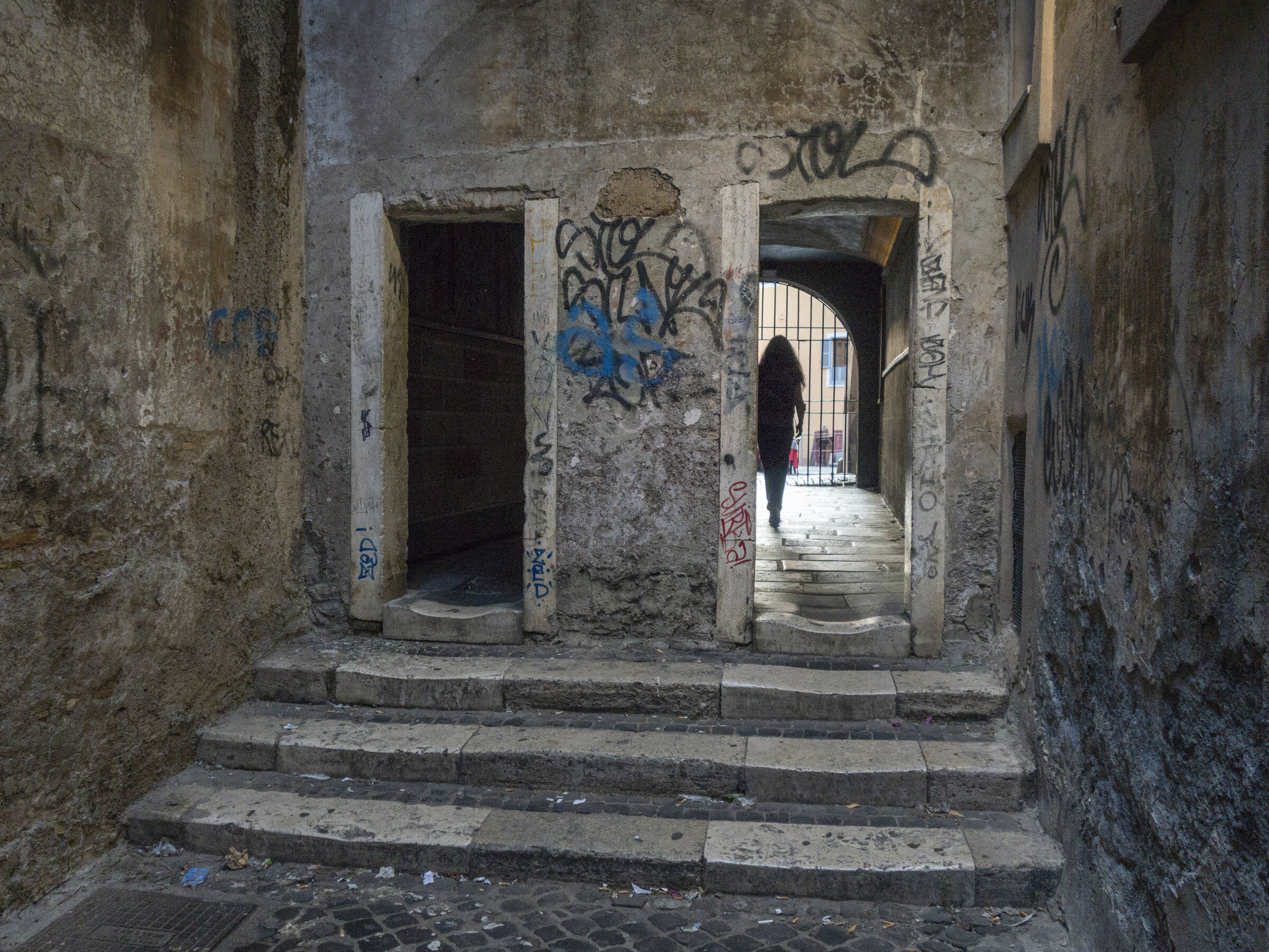 Interior of the Passetto del Biscione covered passage in Rome, with vaulted ceiling and frescoed walls
