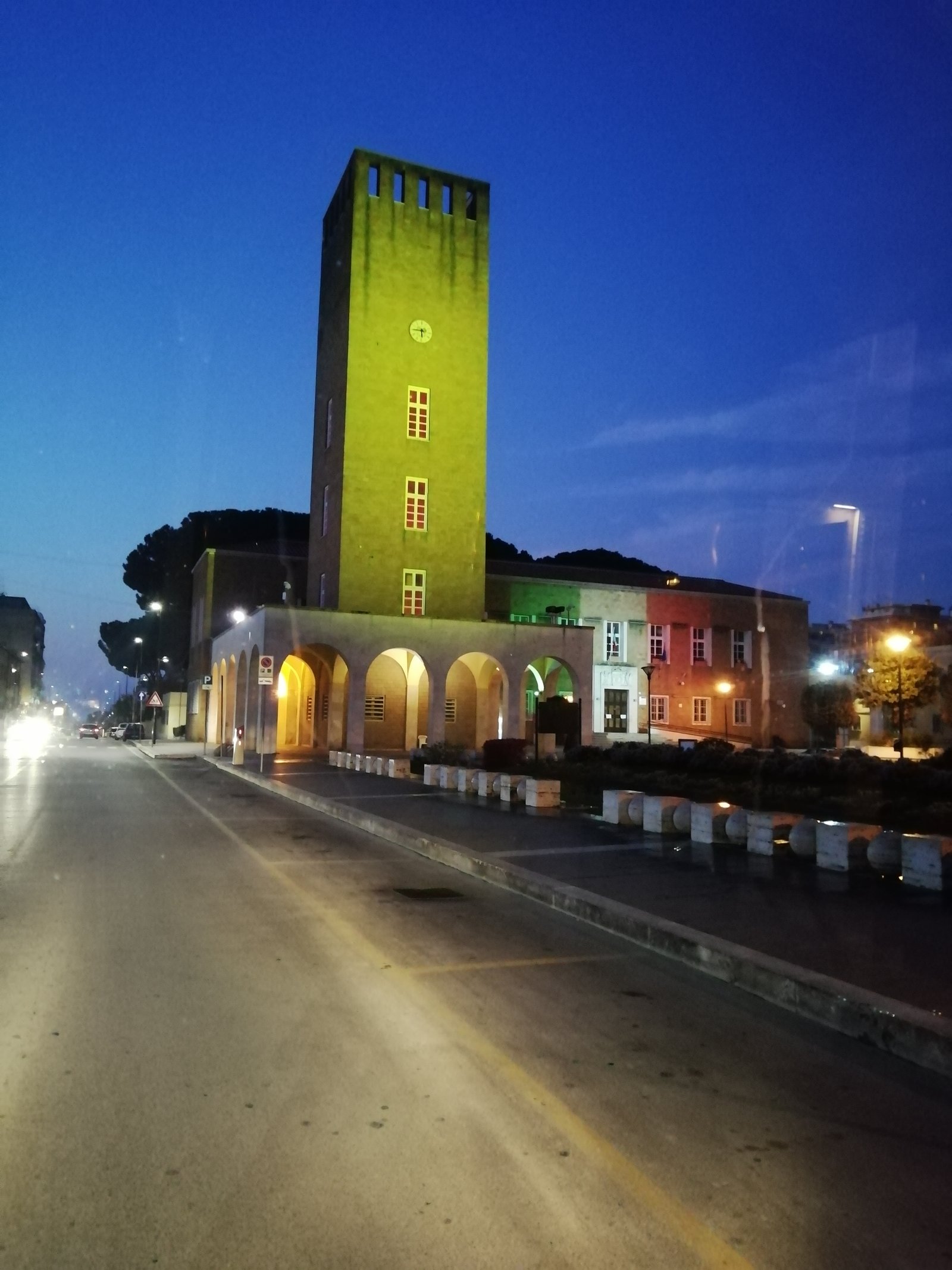 Piazza Indipendenza in Pomezia with the Torre Civica rising over the rationalist arcades of the new town