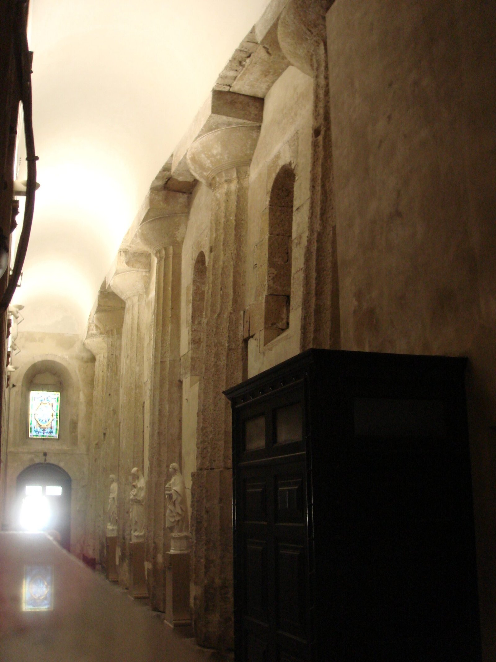 Ancient Doric columns of the Temple of Athena embedded in the left aisle of Syracuse Cathedral