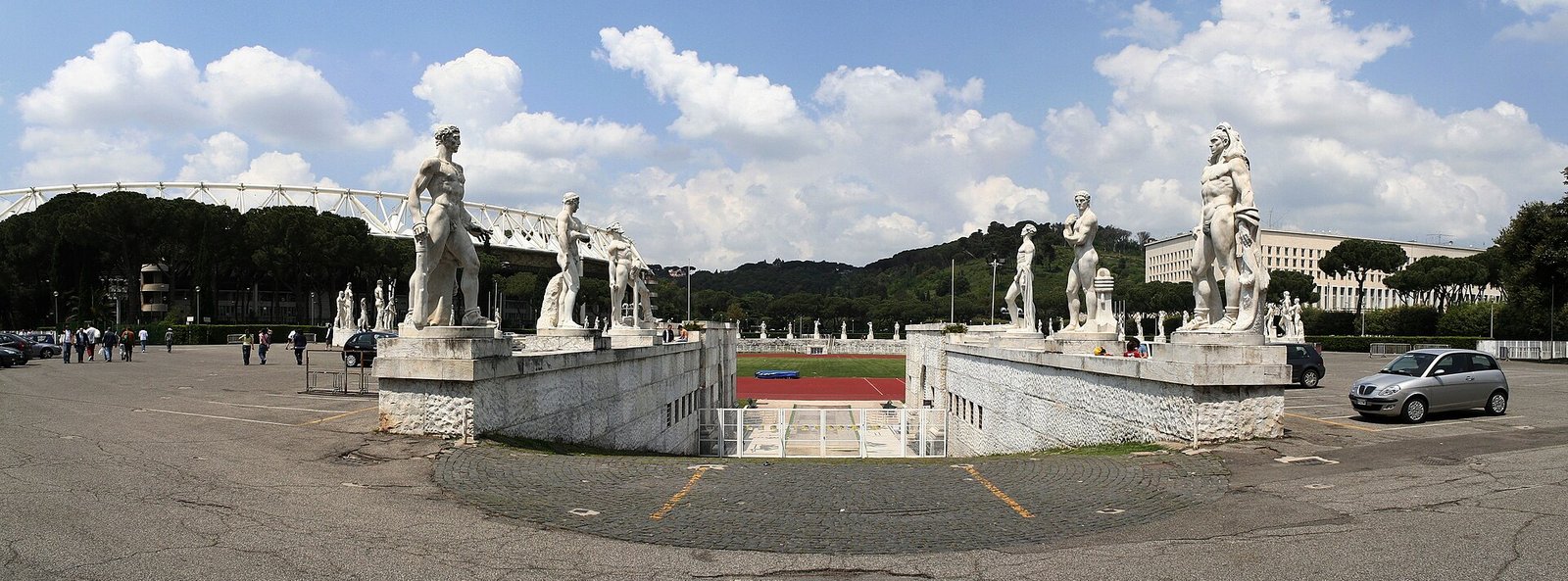 Panoramic view of the Stadio dei Marmi at the Foro Italico in Rome, marble track ringed by classical statues of athletes