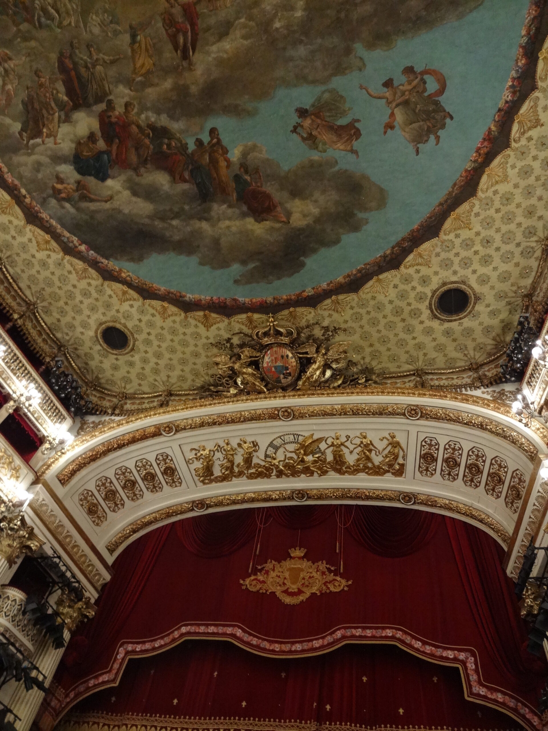 Interior of the Teatro di San Carlo in Naples: gilded proscenium arch and painted ceiling above the auditorium