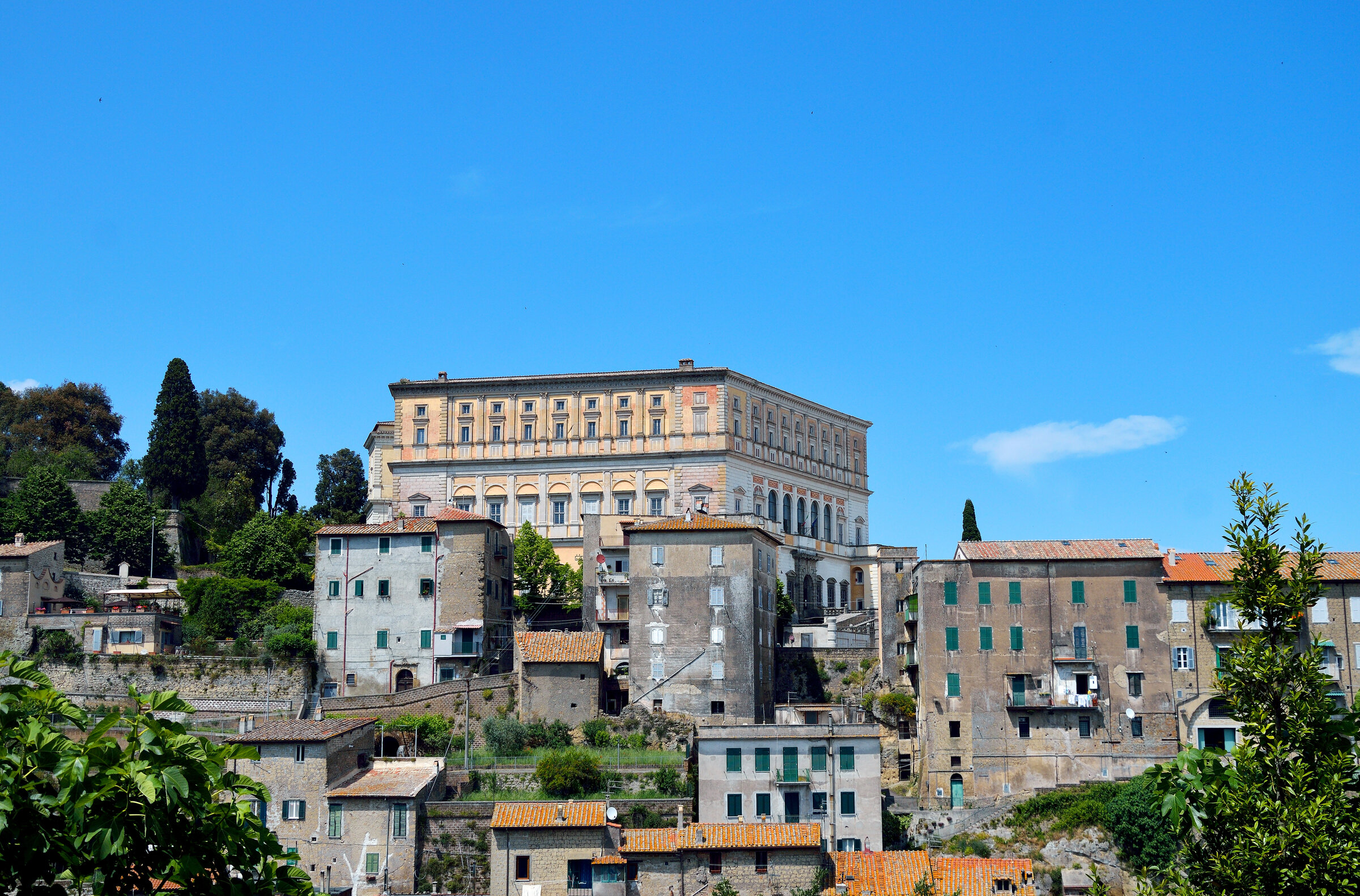 Pentagonal facade of Villa Farnese rising above the village of Caprarola in northern Lazio