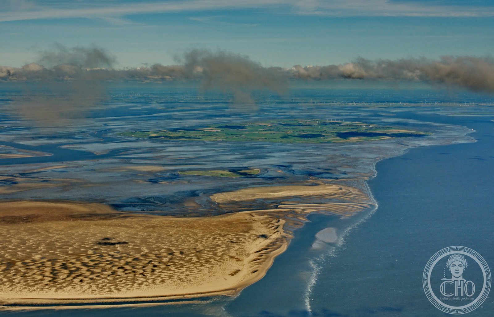 Aerial view of the Wadden Sea tidal flats at low tide, showing the vast mudflat landscape of the North Sea coast