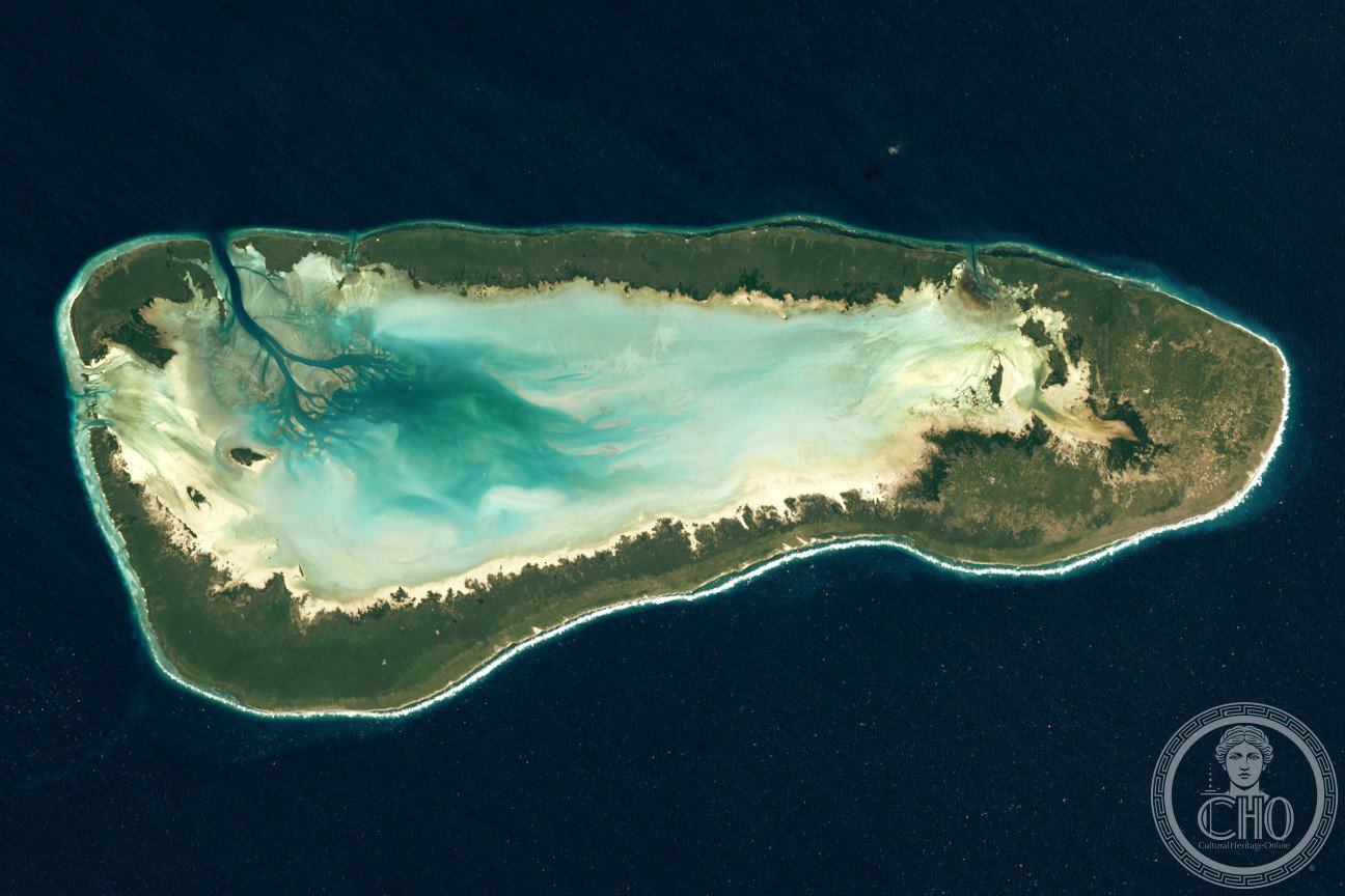 Aerial view of Aldabra Atoll in the Seychelles, showing the coral reef, turquoise lagoon and mangrove-fringed islets