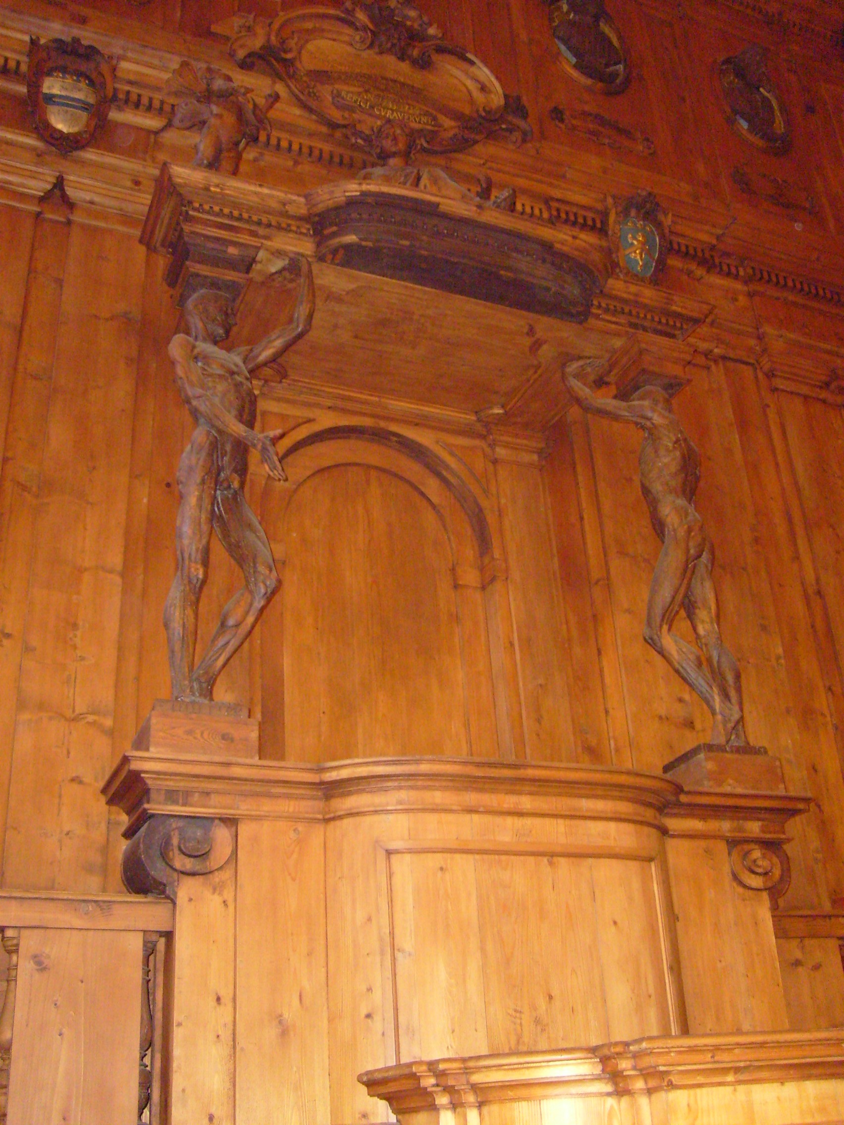 Anatomical theatre (the teacher's chais with the statues of the "Spellati" - skinned), Palazzo dell’Archiginnasio, Bologna, Italy