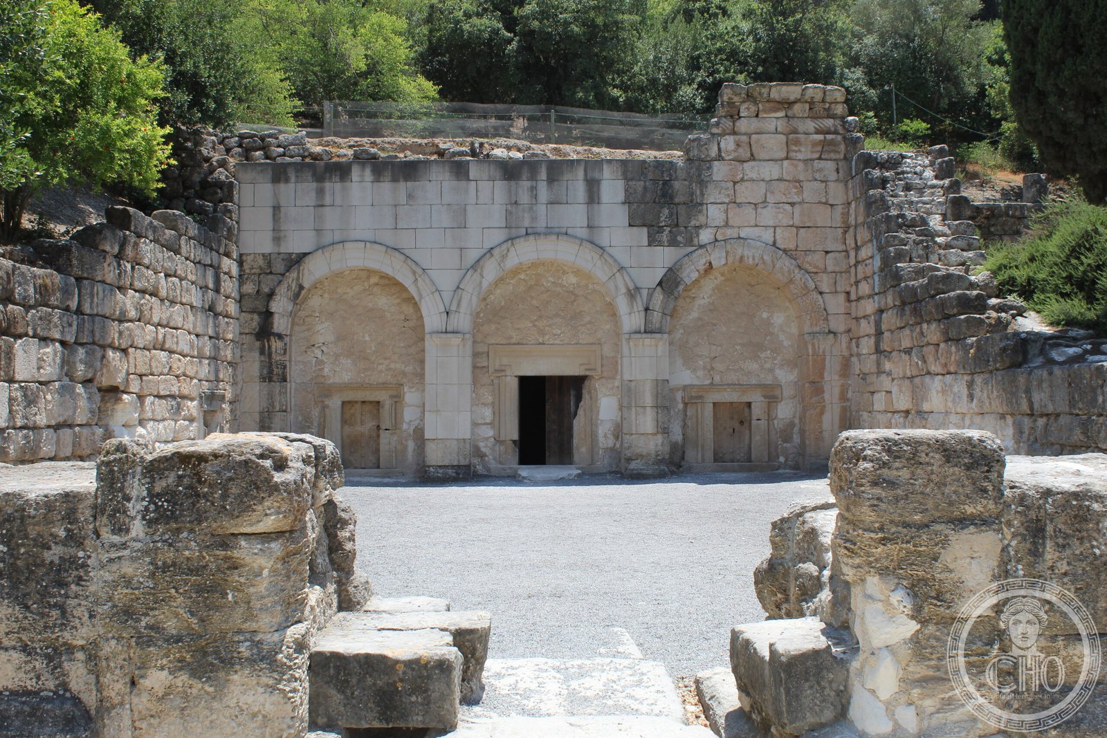 Interior of Catacomb No. 20 at Beit She'arim, Israel — arched burial chambers cut into limestone with reconstructed stone coffins