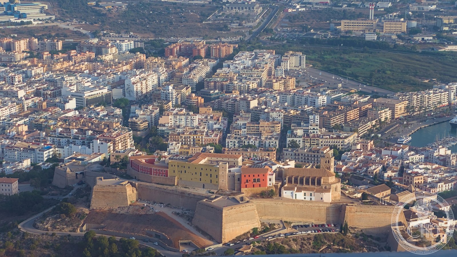 Aerial view of Dalt Vila, the walled old town of Ibiza, rising above the port and the Mediterranean sea