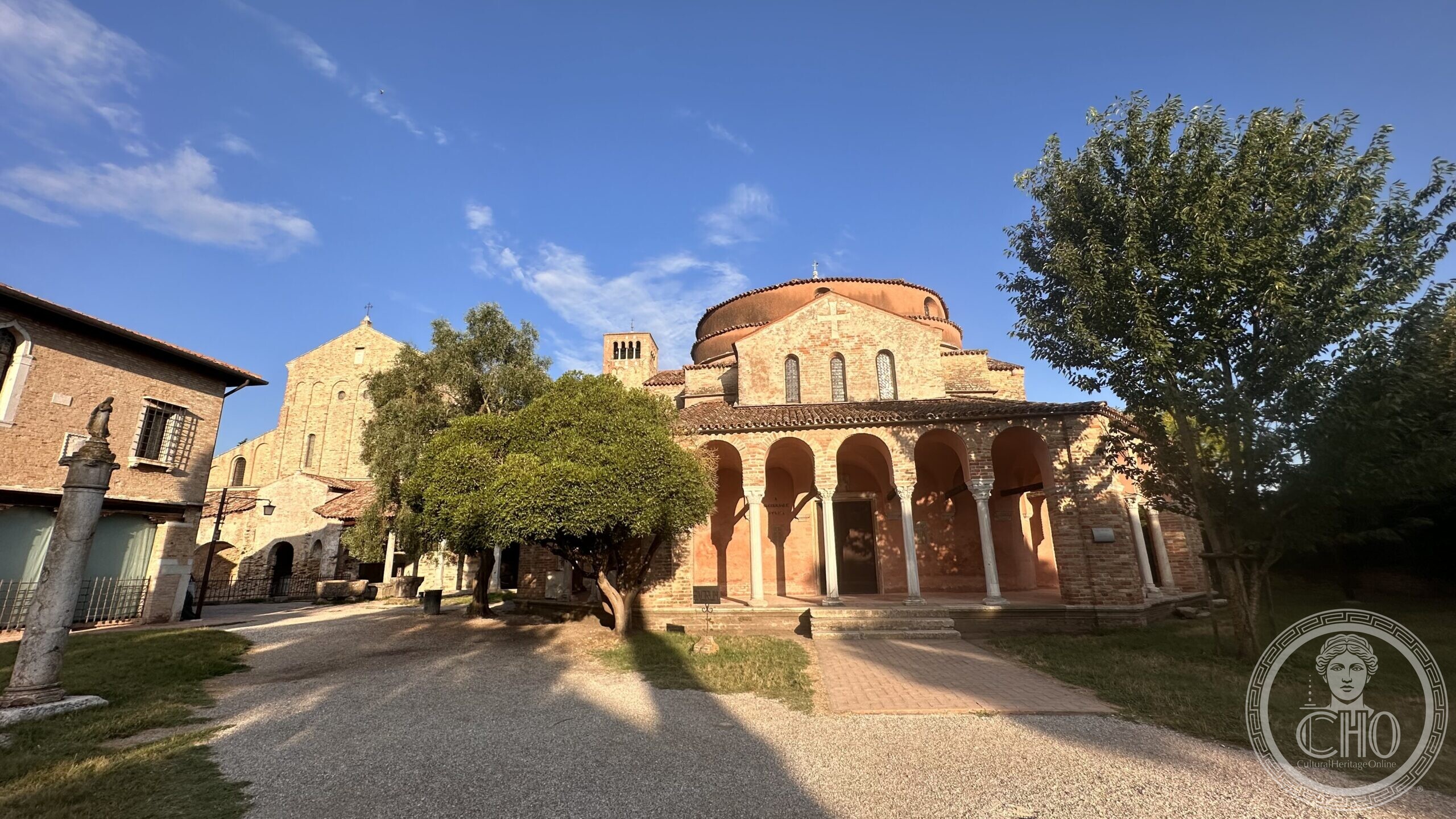 The Basilica di Santa Maria Assunta at Torcello with its campanile and cypress trees