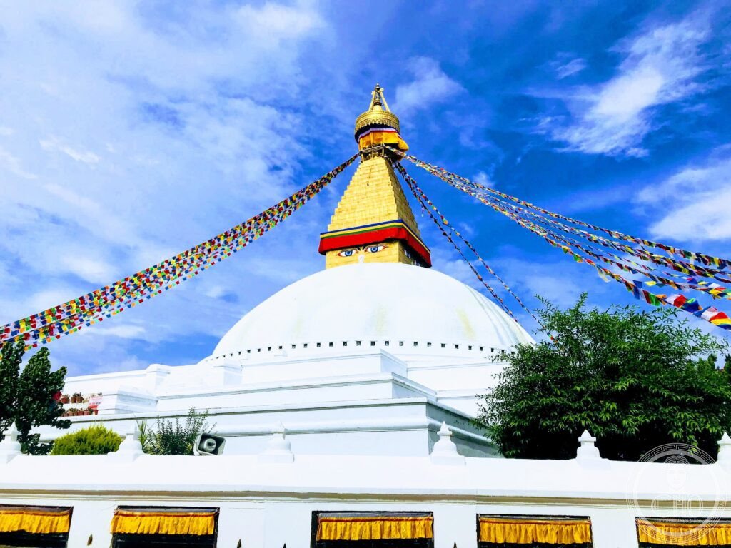 Kathmandu Valley Boudhanath Stupa eyes of Buddha Himalaya Nepal Tibetan Buddhism pilgrims prayer flags UNESCO World Heritage