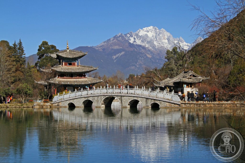 Lijiang China Black Dragon Pool park Jade Dragon Snow Mountain reflection Naxi traditional architecture pavilion UNESCO World Heritage Yunnan