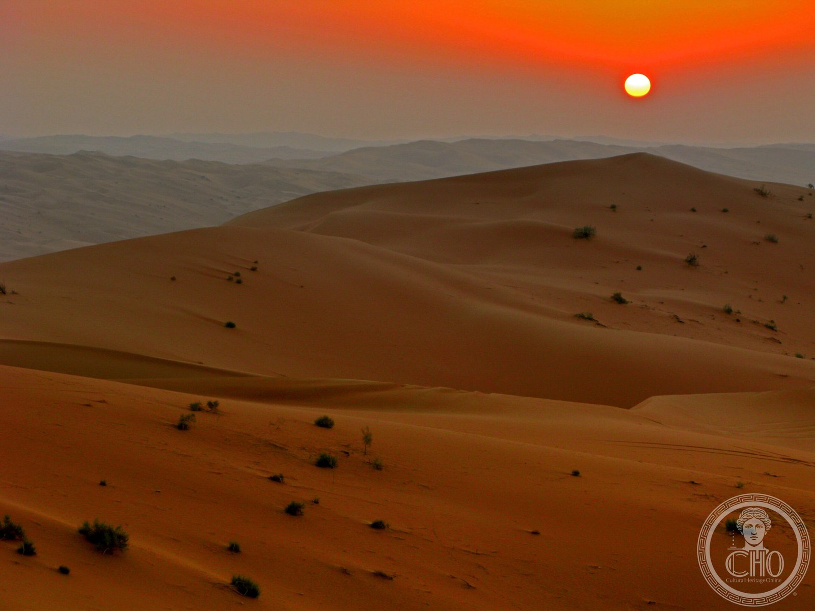Sunset over the red sand dunes of the Rub' al-Khali (Empty Quarter) in Saudi Arabia — the desert landscape of the 'Uruq Bani Ma'arid nature reserve, home to the Arabian oryx