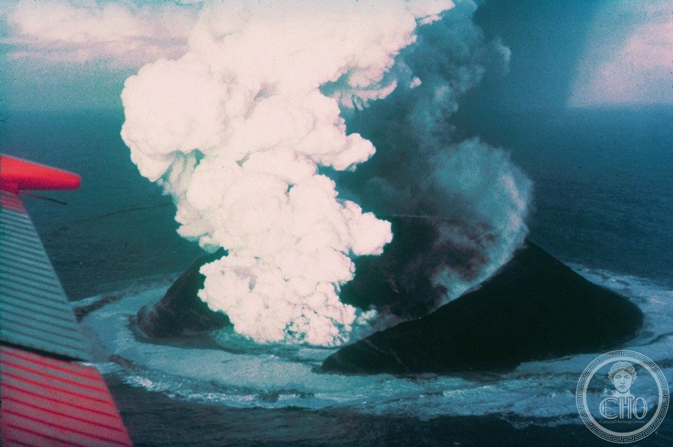 Surtsey volcanic island erupting from the sea in November 1963, Iceland, with ash and lava columns rising from the ocean