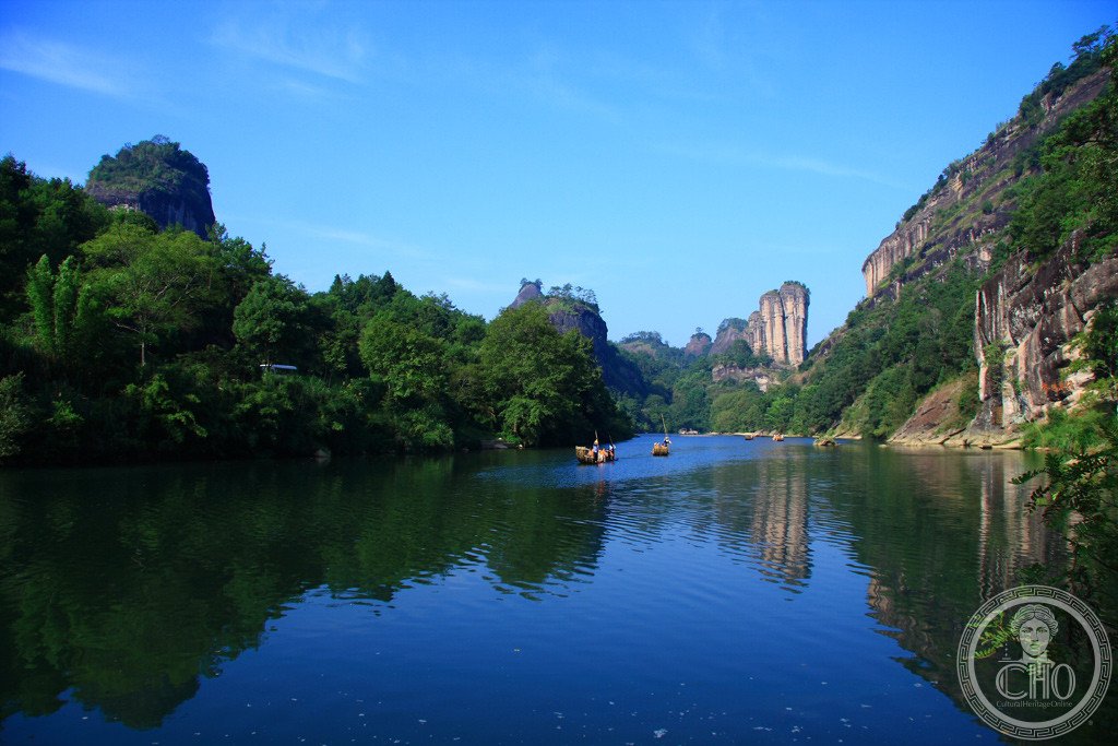 Sea of clouds between the granite peaks of Wuyi Mountains in Fujian, China, at dawn with forested slopes
