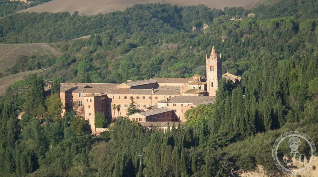 Abbazia di Monte Oliveto Maggiore, veduta aerea del complesso olivetano tra le crete senesi e i cipressi, Siena, Toscana