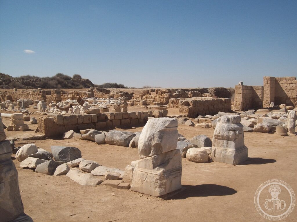 Excavated limestone ruins, column bases and low walls of the early Christian city of Abu Mena, Egypt
