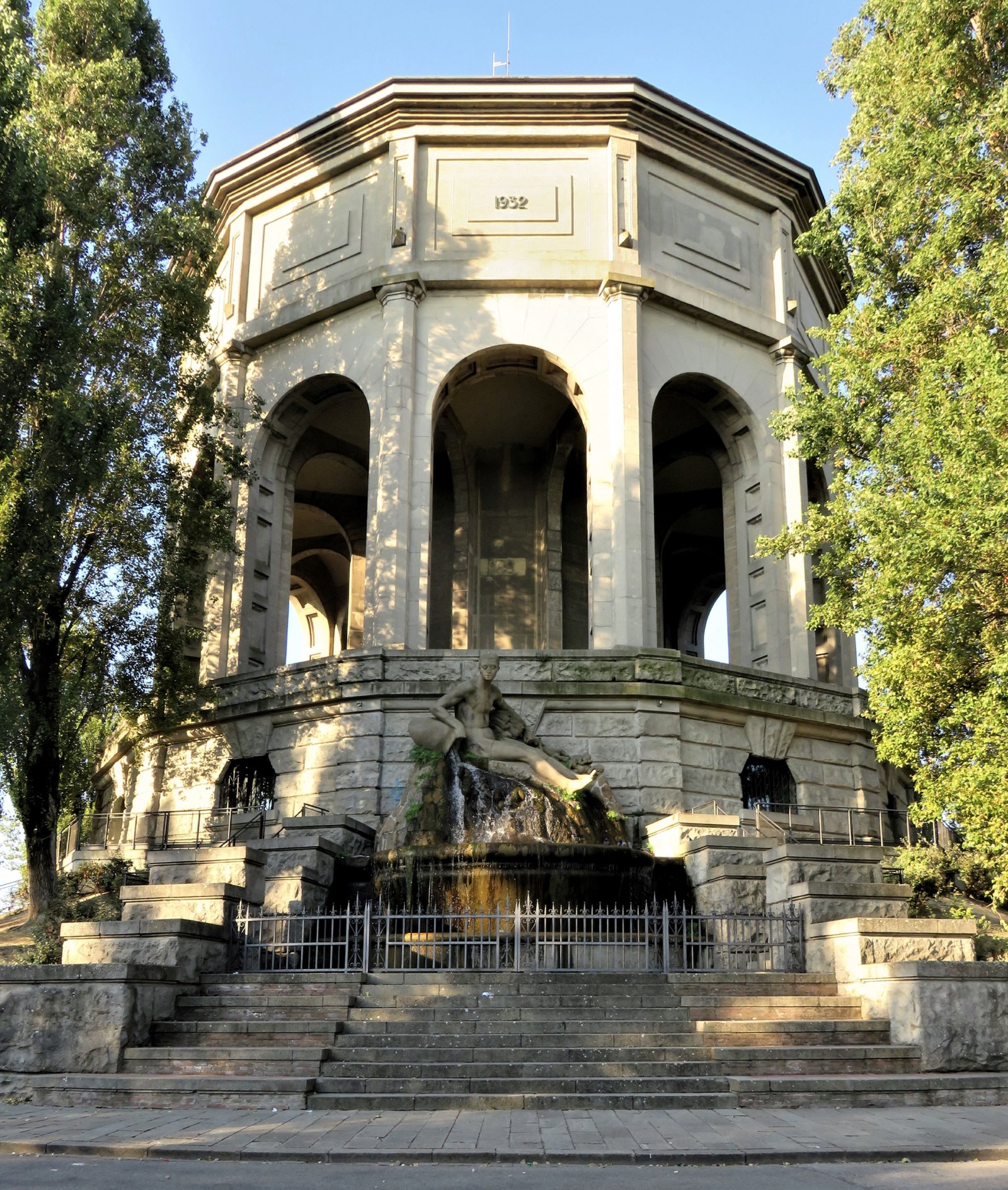 Monumental facade of the Acquedotto di Ferrara with its dodecagonal colonnade and fountain by Arrigo Minerbi.