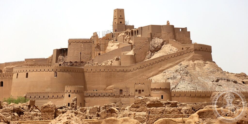 The towering mudbrick citadel of Arg-e Bam rising above the desert in Iran