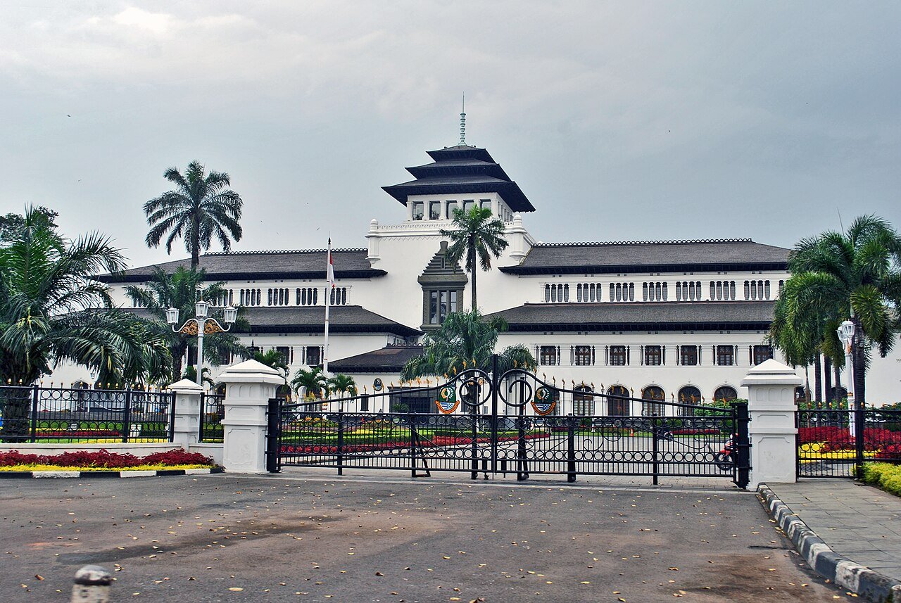 Gedung Sate's central tower and arcaded facade against the Bandung sky