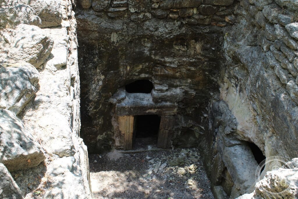 A rock-cut catacomb entrance carved into the hillside at the necropolis of Beit She'arim