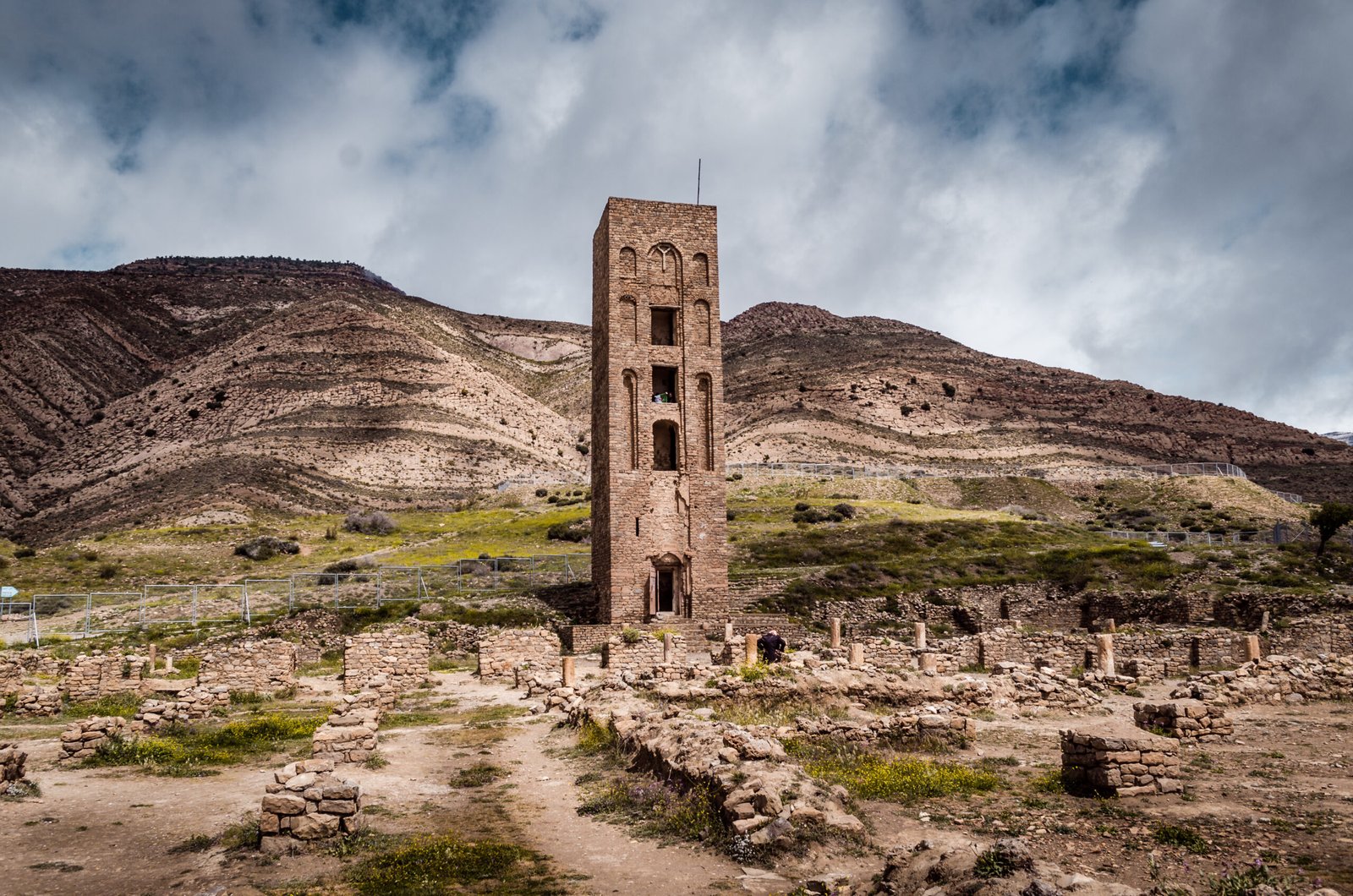 Ruins of Al Qal'a of Beni Hammad — stone walls and minaret remains on the Hodna mountain ridge, Algeria