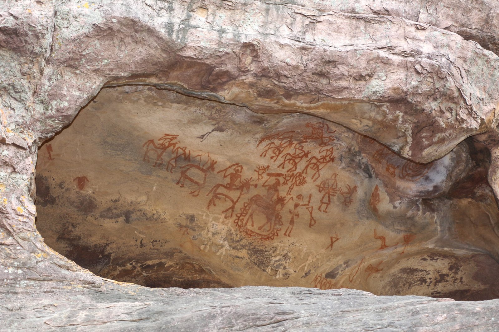 Bhimbetka rock shelter with ancient prehistoric rock paintings on cave walls, India