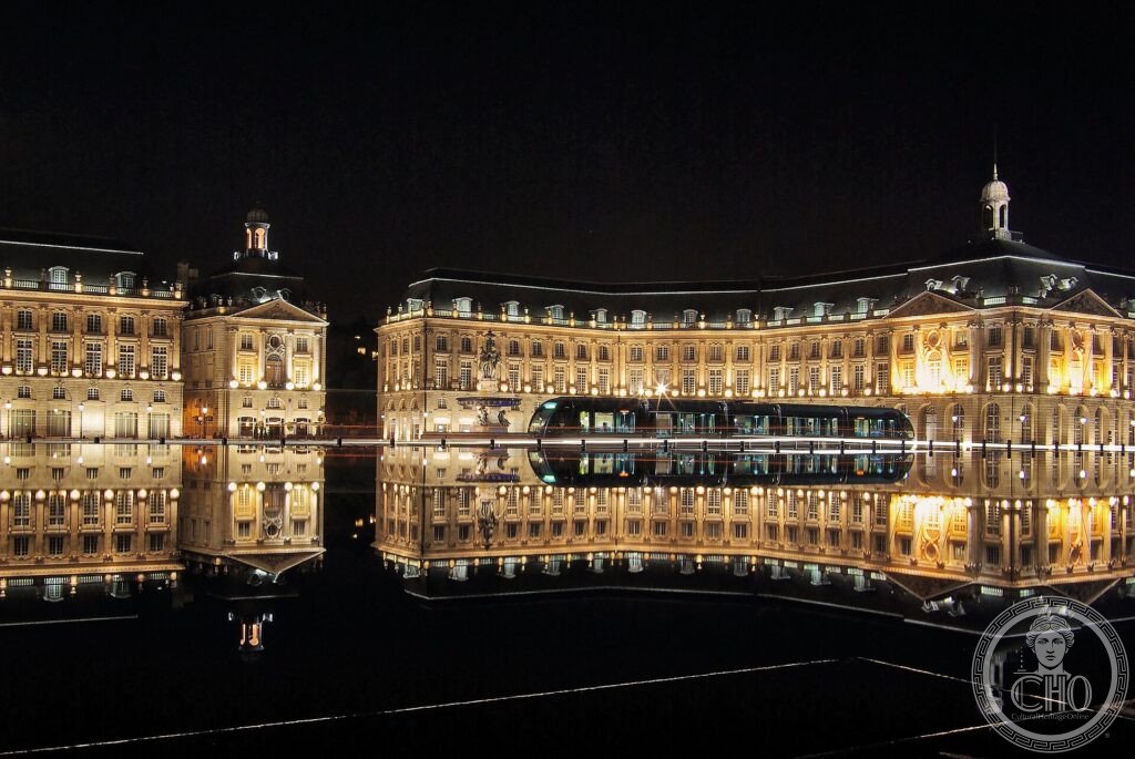 The 18th-century Place de la Bourse in Bordeaux mirrored in the water at night