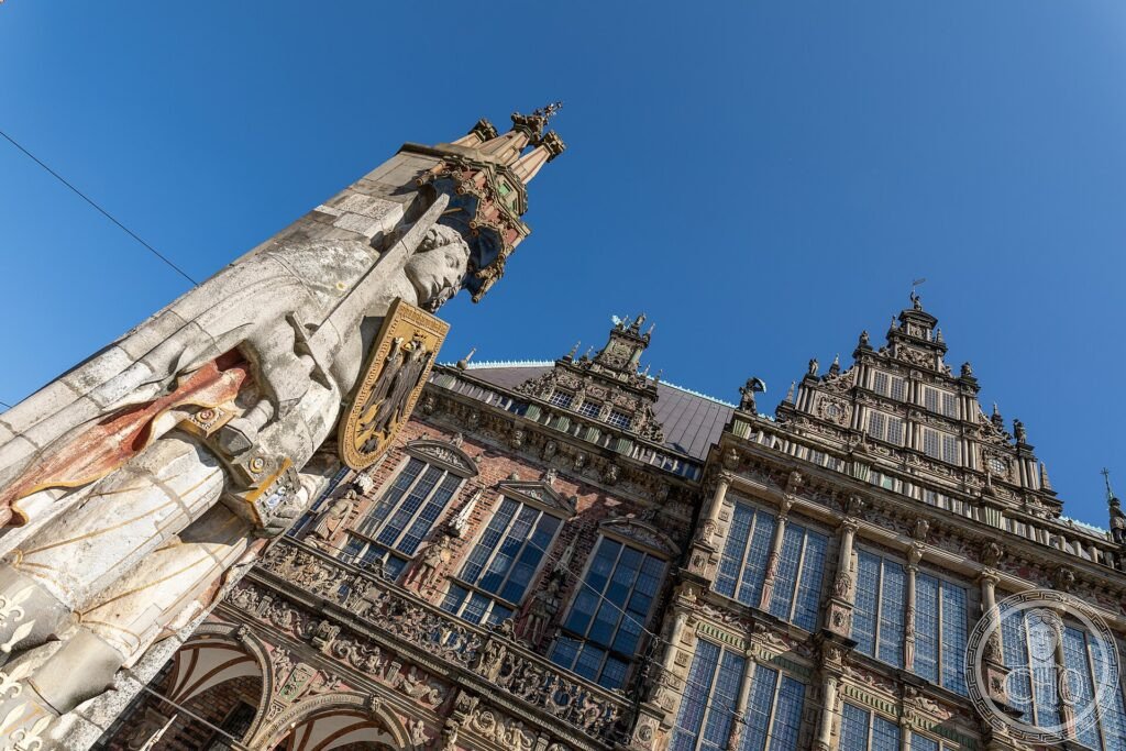 The Roland statue rising before the ornate Renaissance façade of Bremen Town Hall