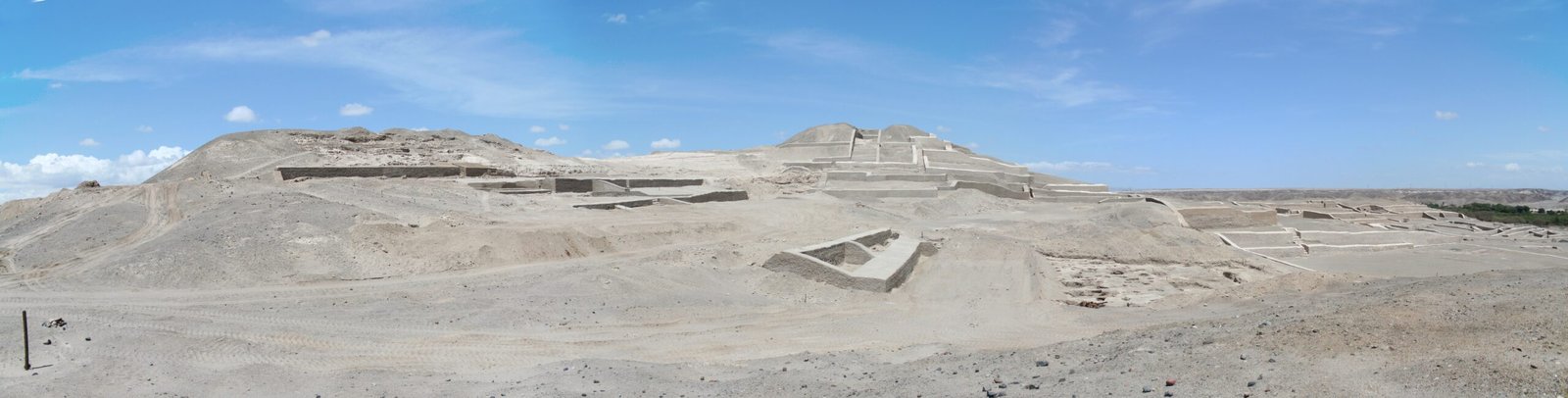 Adobe pyramid mounds of Cahuachi rising from the desert pampa near the Nasca River, southern Peru