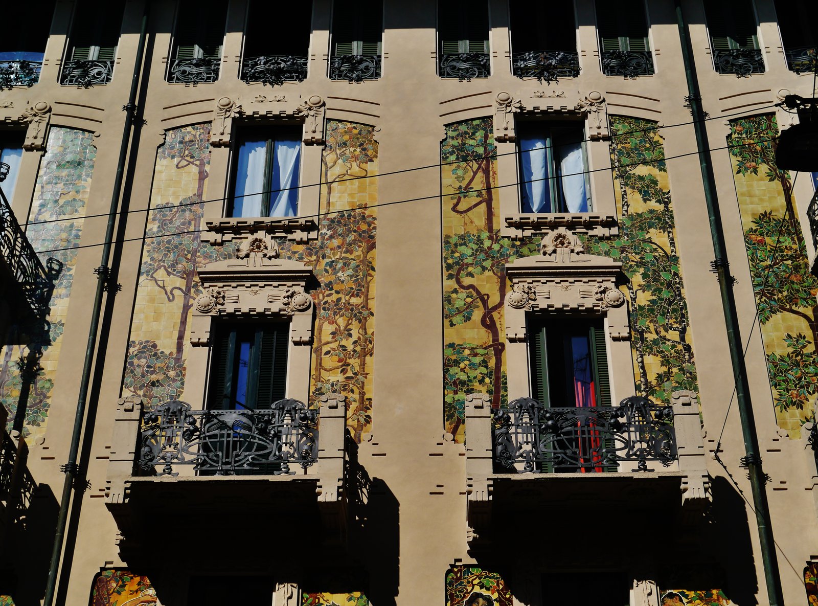 Casa Galimberti southern facade on Via Malpighi Milan with polychrome ceramic tiles