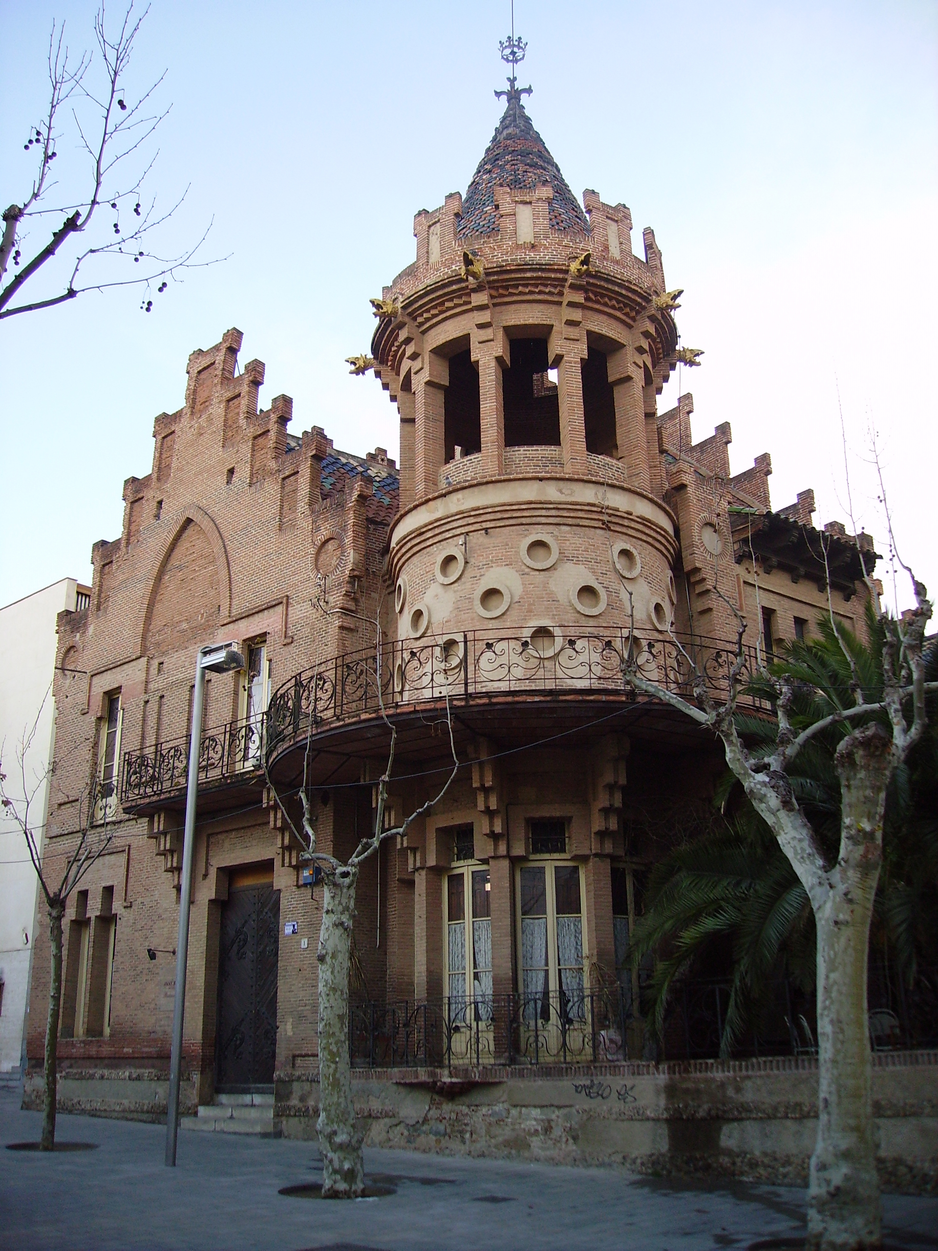 The brick mansion of Casa Roura with its conical ceramic-clad corner tower in Canet de Mar