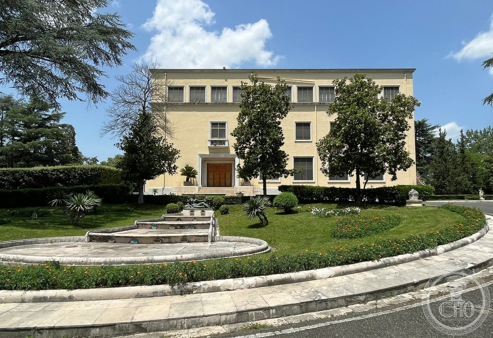 Presidential Palace Tirana Pallati i Brigadave south facade stone-clad ground floor and Rationalist symmetrical composition by Bosio