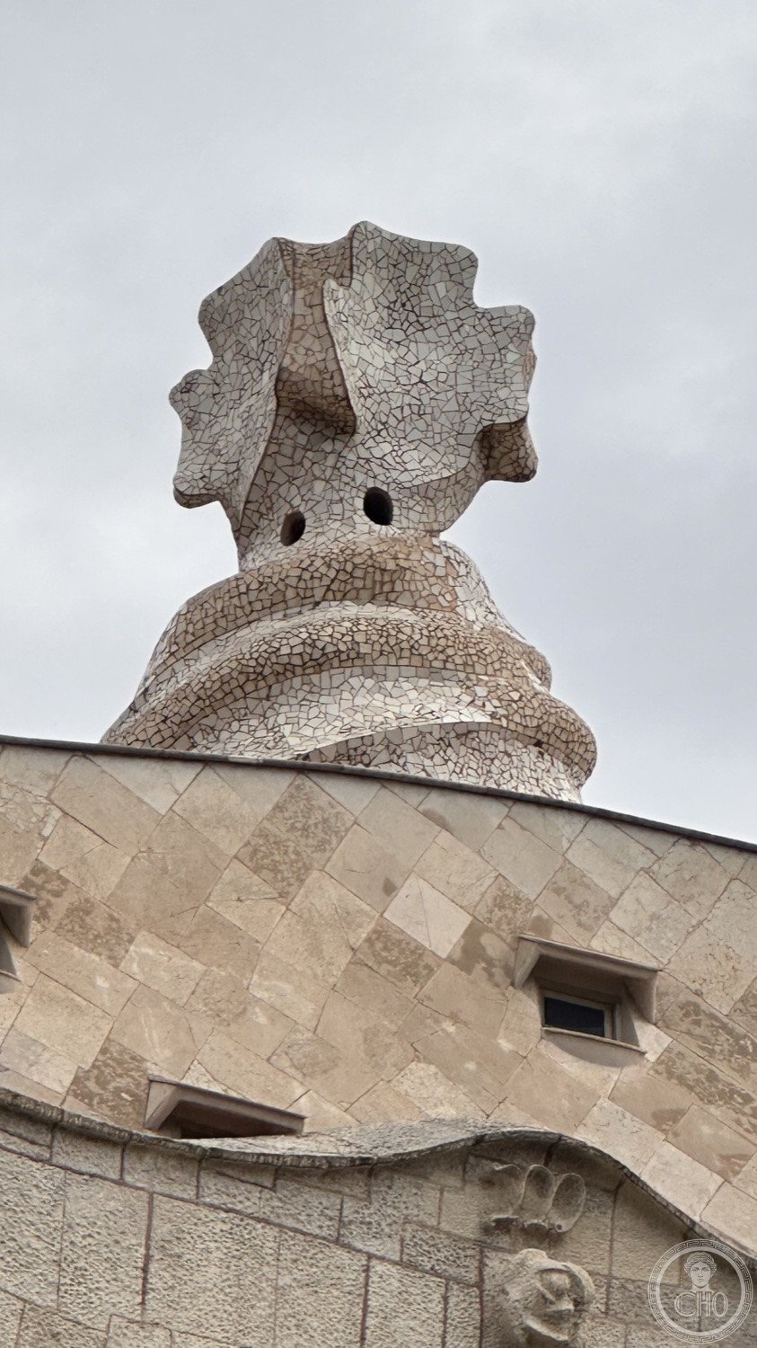 Casa Milà (La Pedrera) — A chimney stack rising from the rooftop landscape.
