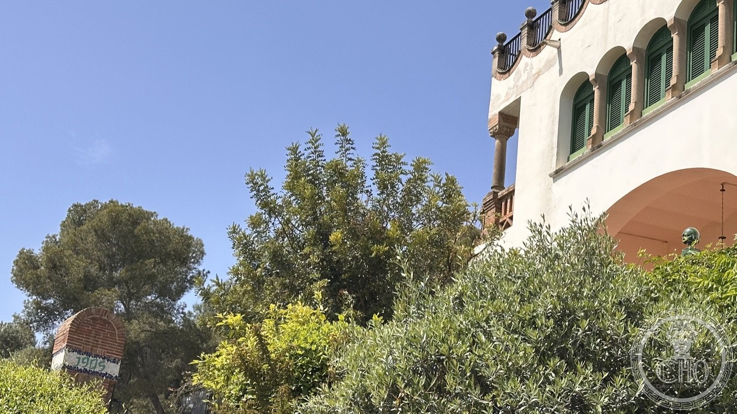 Park Güell — One of the pavilions among the trees of the park.