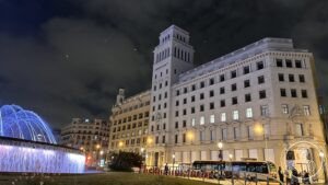 Plaça de Catalunya — The illuminated fountains and the square after dark.