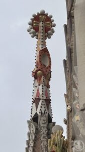 Basílica de la Sagrada Família — A finished spire crowned with its coloured Venetian-glass pinnacle.