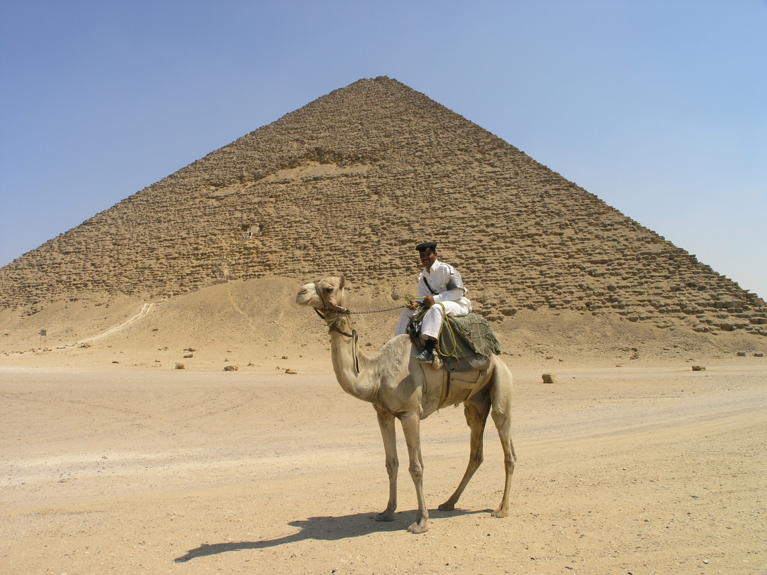 Tourist policemen on camels before the Red Pyramid at Dahshur, Egypt