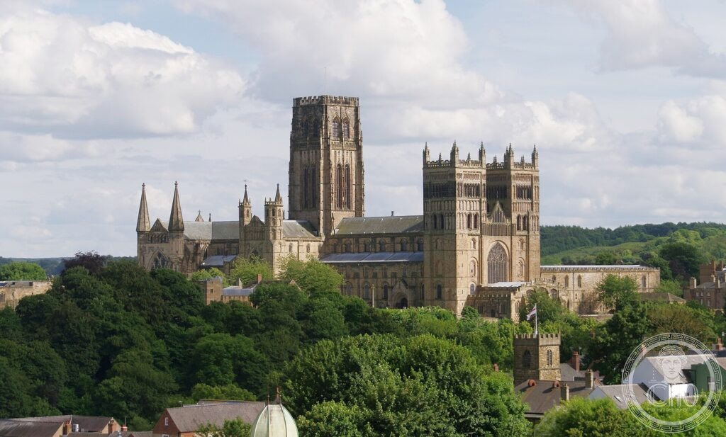 Durham Cathedral with its Norman towers rising above wooded slopes over the River Wear