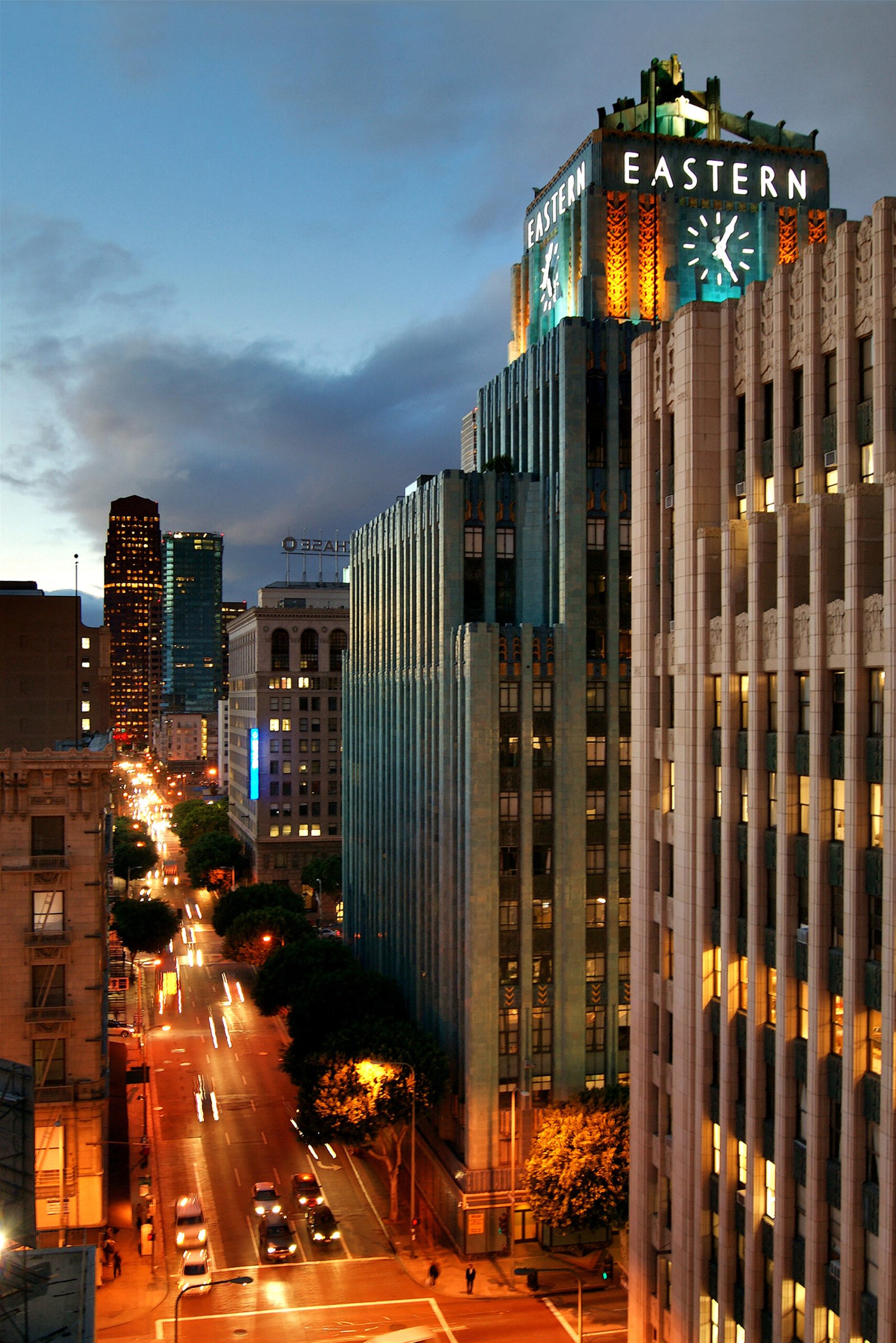 Turquoise terra-cotta tower of the Eastern Columbia Building in Los Angeles with its central clock