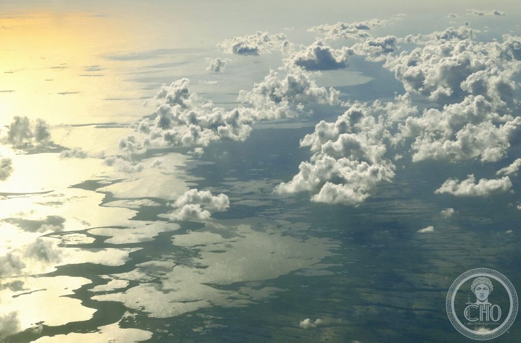 Aerial view of the watery sawgrass marshes and tree islands of the Everglades under clouds, Florida