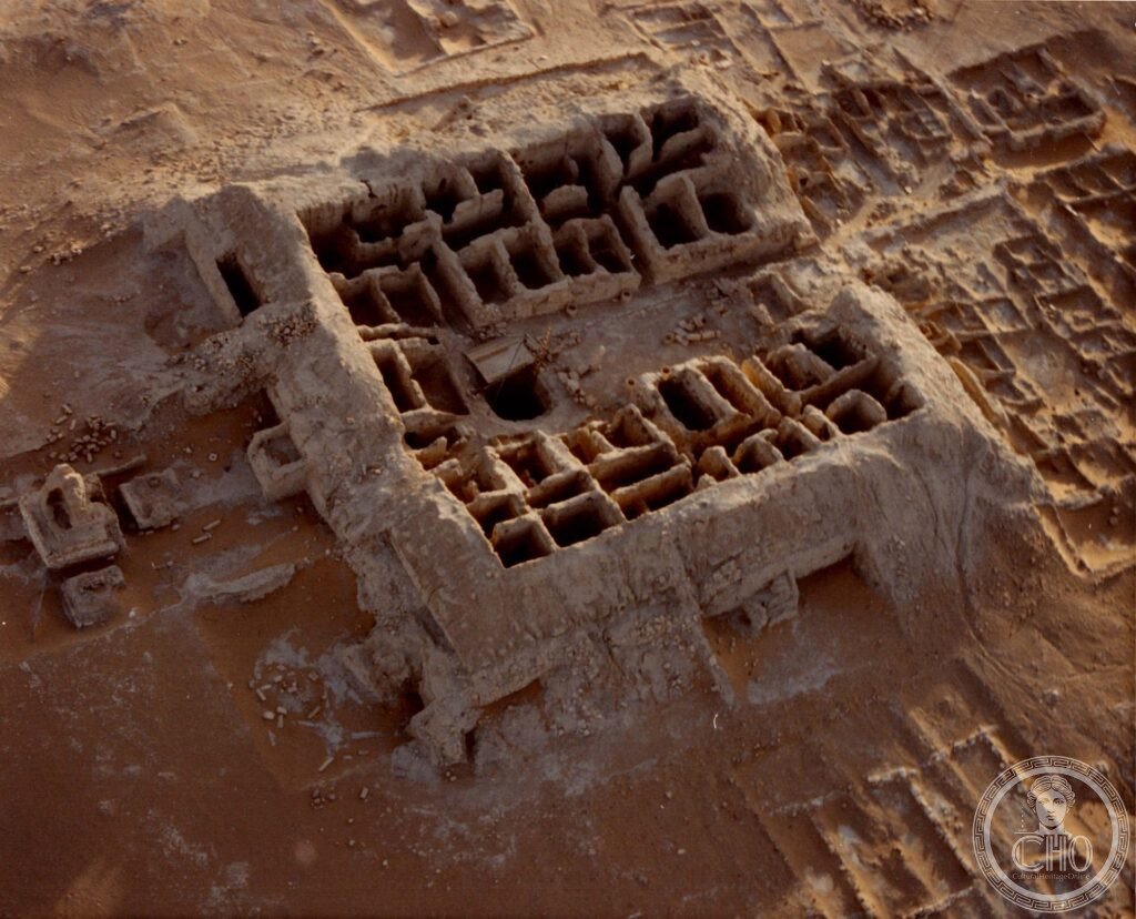 Aerial view of the excavated mud-brick foundations of the ancient city of Qaryat al-Faw in the desert