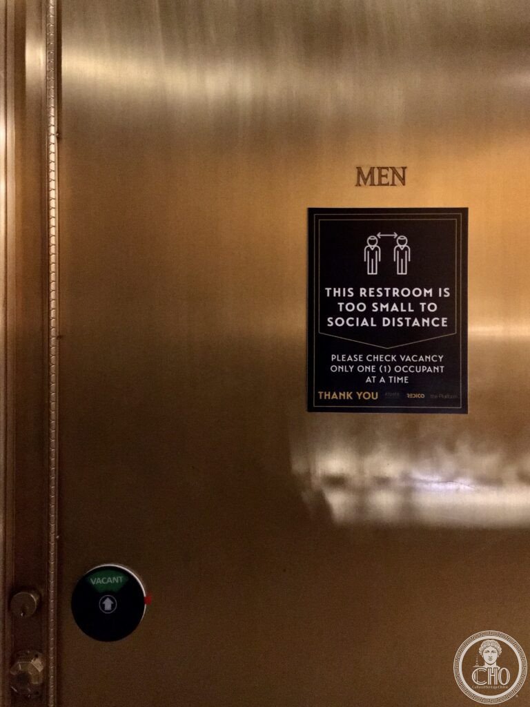 As seen inside the Fisher Building in Detroit, Michigan, December 2020: a sign on the gold leaf-cove