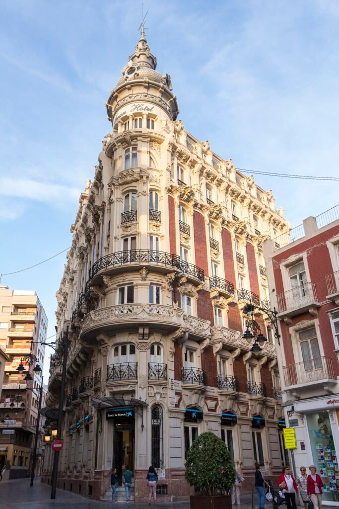The domed Modernista corner façade of the Gran Hotel de Cartagena in brick and white stone The domed Modernista corner façade of the Gran Hotel de Cartagena in brick and white stone