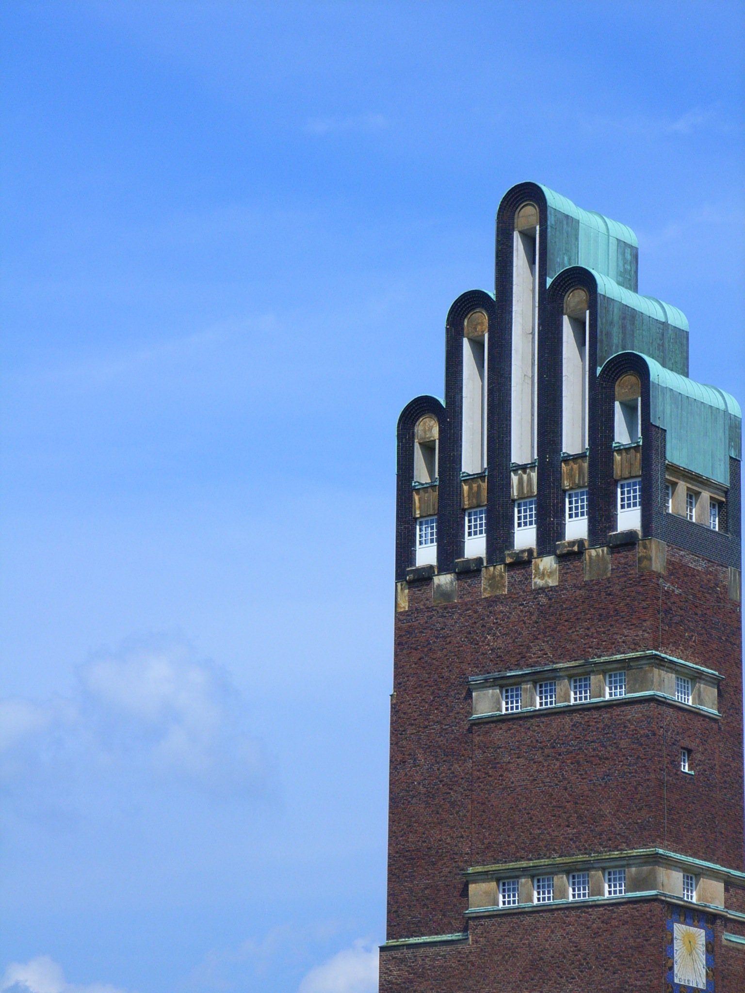 The brick Wedding Tower at Darmstadt with its distinctive five-finger rounded roofline