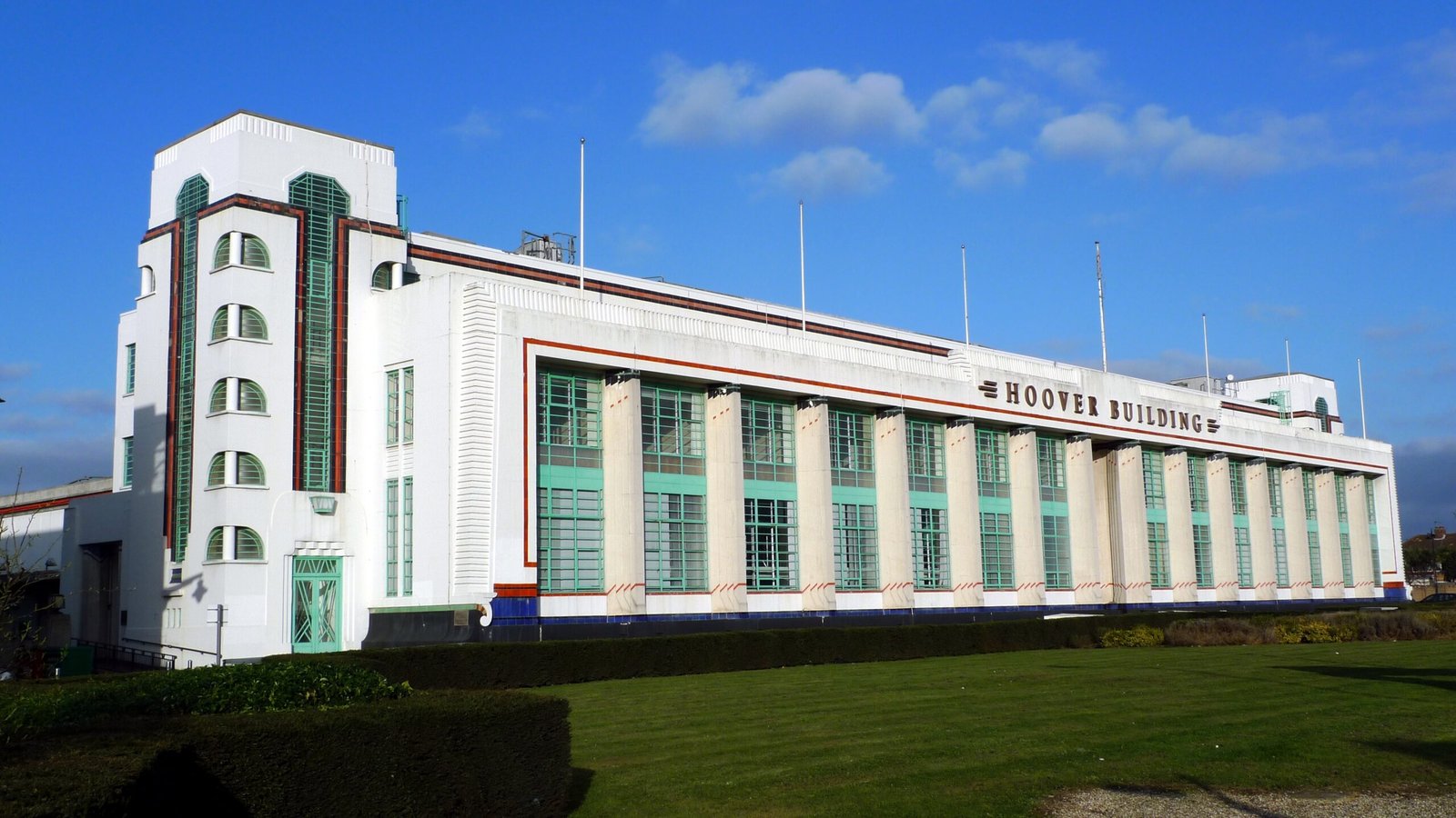 White Art Deco facade of the Hoover Building on Western Avenue, London, with coloured geometric detailing