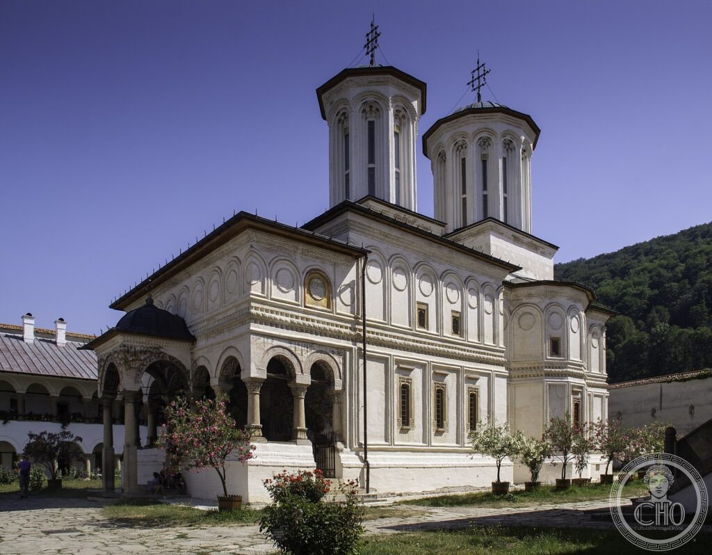 The white Brâncovenesc church of Horezu Monastery with carved porch and twin towers