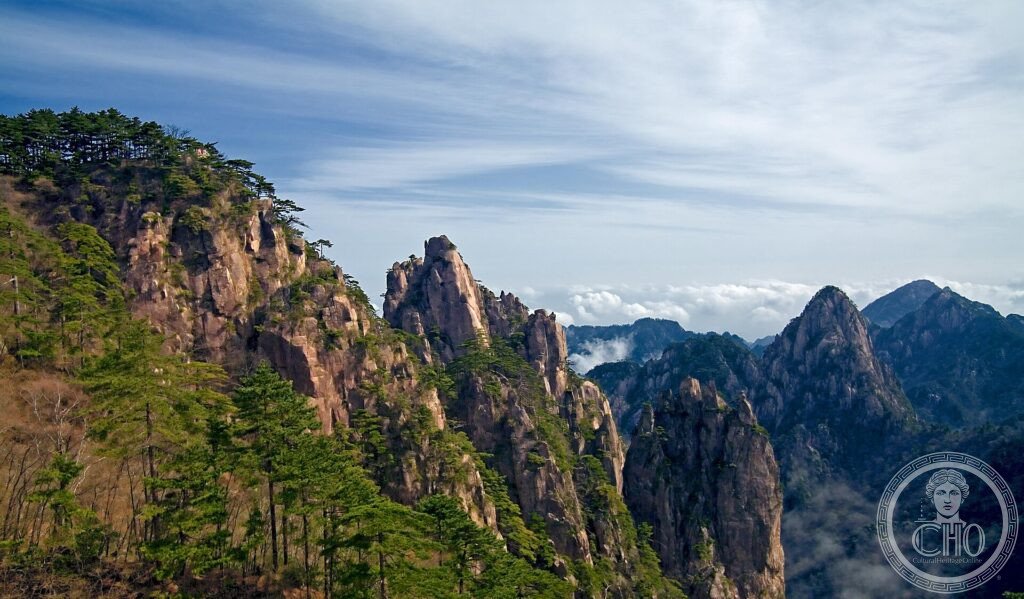 Granite peaks and gnarled pines rising above a sea of clouds at Mount Huangshan